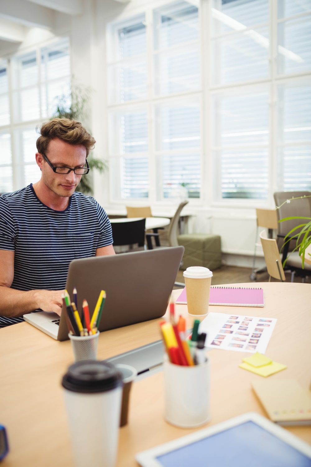 graphic-designer-working-his-desk-min