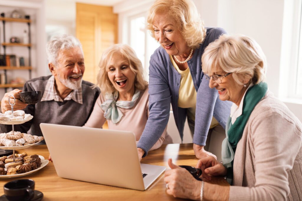 group of happy seniors surfing the net on laptop a 2024 12 13 21 17 10 utc scaled 1