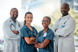 hospital happy team portrait doctors with crossed arms medical care wellness support healthcare diversity men women workers service medicine consulting clinic scaled 1